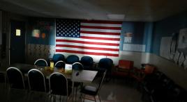 The flag in a darkened room