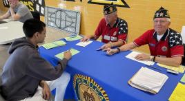 Post 178 Legionnaires register new voters at Memorial High School