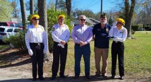 John E. Jacobs American Legion Post 68 (Leland) color guard raises American flag for local veteran assist