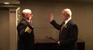 Father gives Oath of Office to son