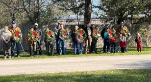 Community honors veterans with wreaths