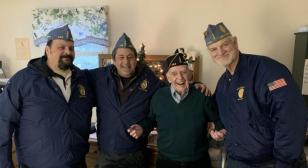 Squadron 440 presents garrison cap to Korean War veteran