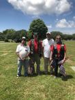 American Legion Braxton-Perkins Post 25 Family places U.S. flags at Peninsula Memorial Cemetery 