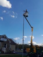 Davey Tree donates time, truck and talent to repaint flagpole at Post 15