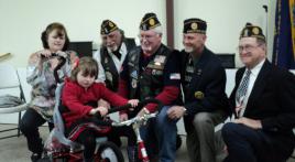 Post 78 Riders help special child receive tryke