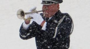 Military bugler performs at 10,000th service