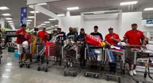 Legion Softball team of Post OK28, Okinawa, Japan, purchase Christmas gifts for children at Amerasian School