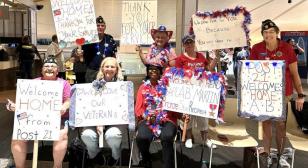 Post 21 welcomes home Honor Flight Heroes