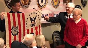 WWII Coast Guard veteran presents USS Machias flag to Grand Haven U.S. Coast Guard Station 